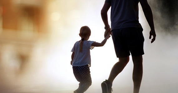 Child fleeing natural disaster with parent